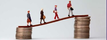 Image of people walking up piles of coins