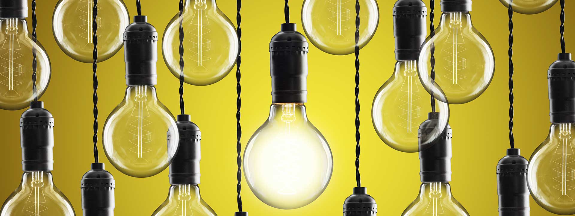 Light bulbs on yellow background