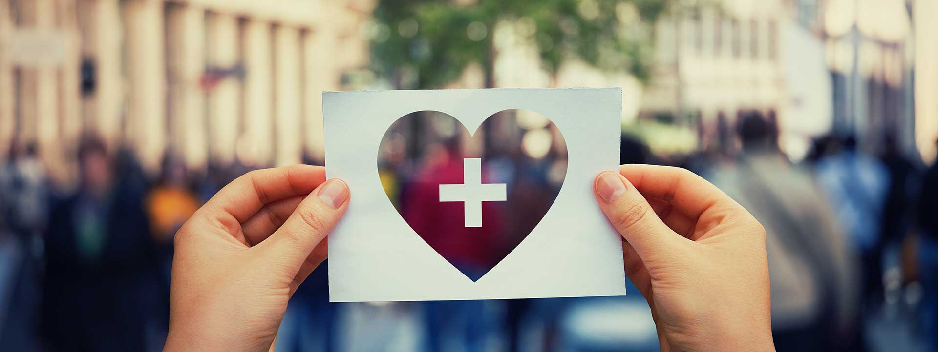 Picture of a heart in front of a crowd