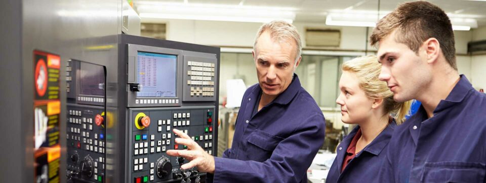 Students being shown how to use equipment